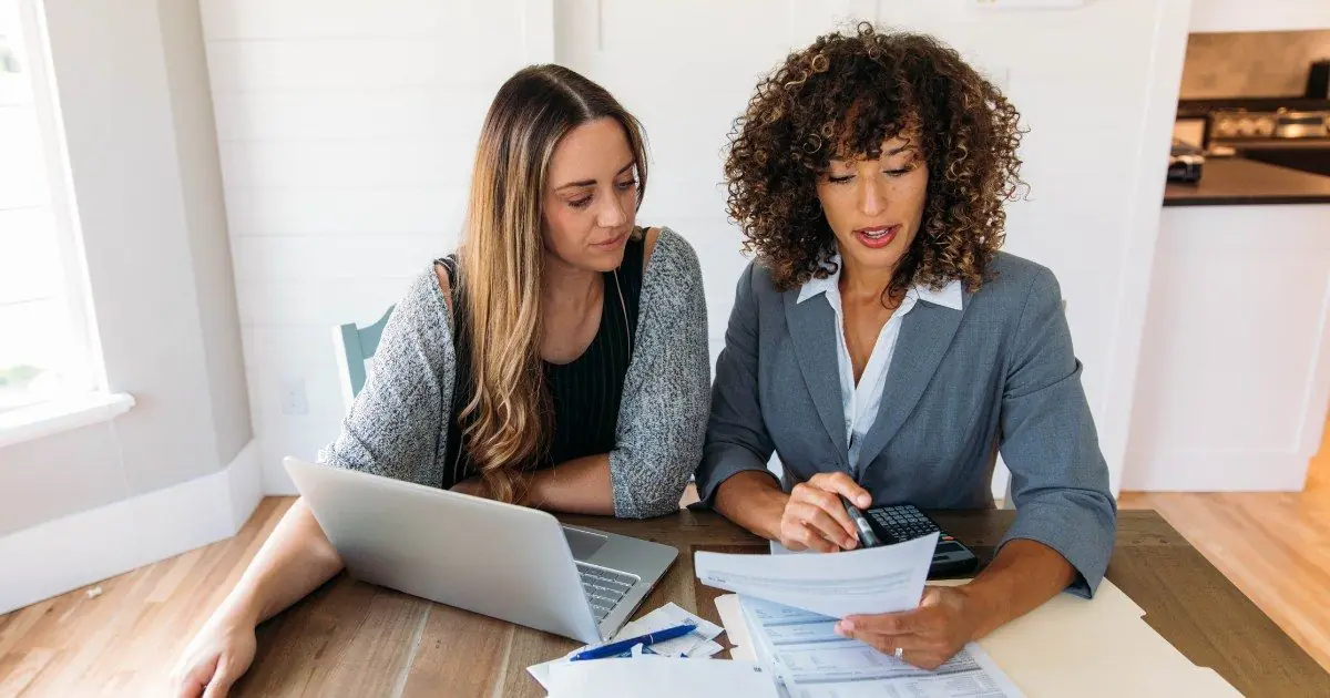 Two professionals reviewing financial documents together
